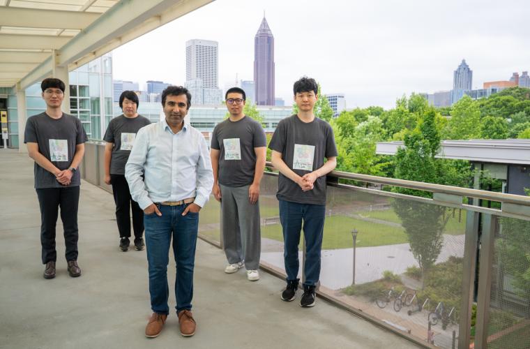 Associate Professor Tushar Krishna (center) and members of his research team — William Won (recently graduated, now at AMD), Changhai Man, Hanjiang Wu, and Jinsun Yoo — have announced Chakra, a new shared platform for understanding and improving complex AI systems.